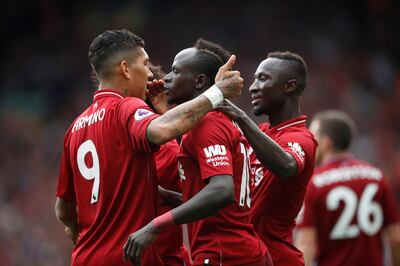 Soccer Football - Premier League - Liverpool v West Ham United - Anfield, Liverpool, Britain - August 12, 2018   Liverpool's Sadio Mane celebrates with Roberto Firmino and Naby Keita after scoring their third goal     Action Images via Reuters/Carl Recine    EDITORIAL USE ONLY. No use with unauthorized audio, video, data, fixture lists, club/league logos or "live" services. Online in-match use limited to 75 images, no video emulation. No use in betting, games or single club/league/player publications.  Please contact your account representative for further details.