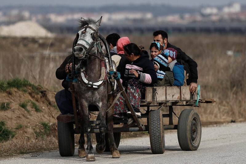 Refugees are being carried by cart heading to the Turkish-Greek border and trying to enter Europe, in Edirne, Turkey.  EPA