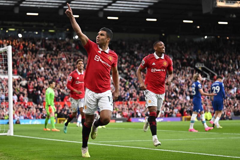 Manchester United's Brazilian midfielder Casemiro celebrates after scoring their opening goal during the English Premier League football match between Manchester United and Chelsea at Old Trafford in Manchester, north west England, on May 25, 2023.  (Photo by Oli SCARFF / AFP) / RESTRICTED TO EDITORIAL USE.  No use with unauthorized audio, video, data, fixture lists, club/league logos or 'live' services.  Online in-match use limited to 120 images.  An additional 40 images may be used in extra time.  No video emulation.  Social media in-match use limited to 120 images.  An additional 40 images may be used in extra time.  No use in betting publications, games or single club/league/player publications.   /  
