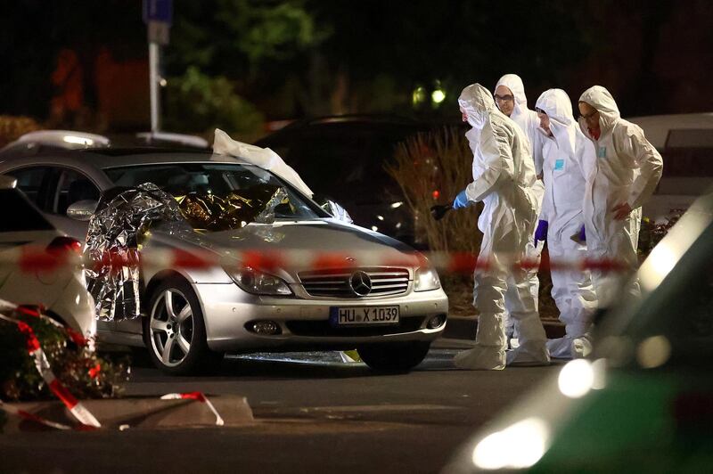 Forensic experts work after a shooting in Hanau near Frankfurt. Reuters