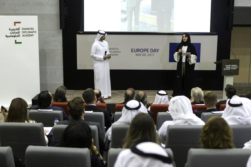 Salem Al Shamsi, left, and Amna Fikri, who are students at the Emirates Diplomatic Academy, speak at an event commemorating the 60th anniversary of the European Union at the school in Abu Dhabi. Christopher Pike / The National / May 9, 2017