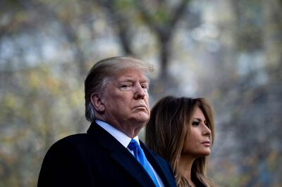 US President Donald Trump and US first Lady Melania Trump listen to Taps during a Veterans Day event at Madison Square Park November 11, 2019, in New York, New York. / AFP / Brendan Smialowski
