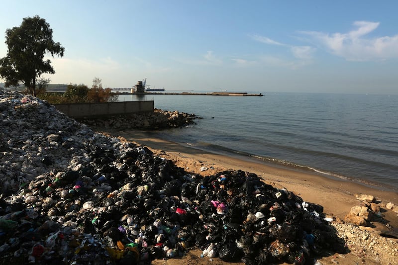 Rubbish is piled up at a temporary garbage dump on a beach in Zalka north of Beirut on December 22, 2015. Lebanon's rubbish crisis began in July when the closure of a landfill caused rubbish to pile up on Beirut's roadsides, in parking lots and river beds. AFP PHOTO / PATRICK BAZ (Photo by PATRICK BAZ / AFP)