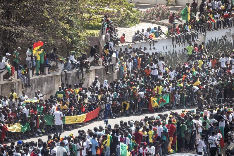 Supporters crowd the roads around the Dakar airport ahead of the Senegalese football team's arrival after winning the Africa Cup of Nations. AFP