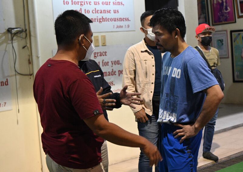 Manny Pacquiao  talking to some constituents inside a basketball gym near his home in the city of General Santos.