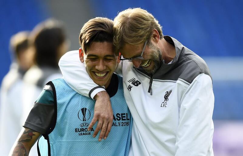 Liverpool manager Jurgen Klopp with Roberto Firmino during training. Dylan Martinez / Reuters