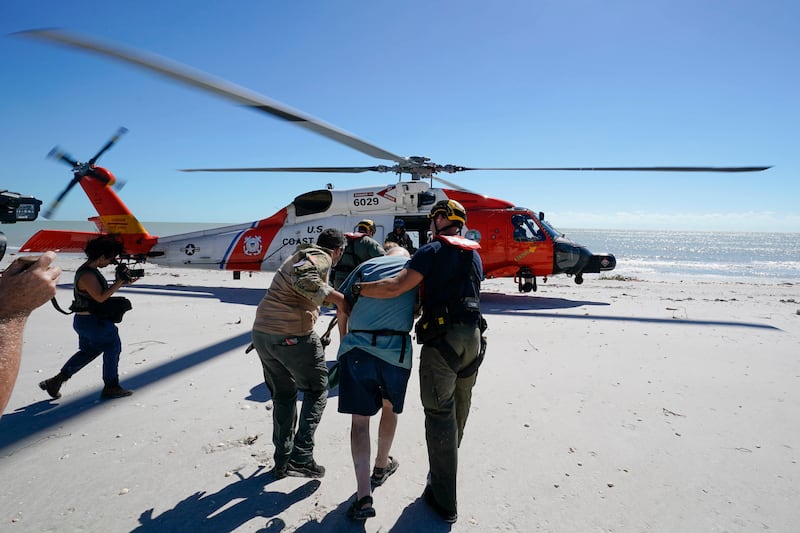 A US Coast Guard helicopter provided residents of Sanibel Island in Florida with an airlift after Hurricane Ian blew through. AP
