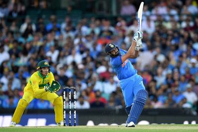 epa07276814 Rohit Sharma of India hits the ball for six during the first One Day International match between Australia and India India at the Sydney Cricket Ground (SCG) in Sydney, Australia, 12 January 2019.  EPA/DAN HIMBRECHTS  EDITORIAL USE ONLY, NO USE IN BOOKS, NEWS REPORTING PURPOSES ONLY AUSTRALIA AND NEW ZEALAND OUT
