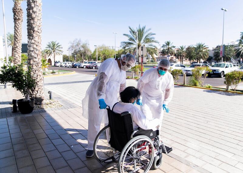ABU DHABI, UNITED ARAB EMIRATES. MAY 2020.
Heathcare workers at Sheikh Khalifa Medical City receive a patient outside the emergency department.
(Photo: Reem Mohammed/The National)

Reporter:
Section: