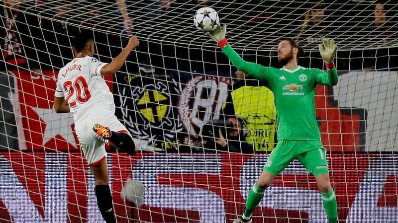 Manchester United goalkeeper David de Gea makes a spectacular save from Sevilla’s Luis Muriel. Jon Nazca / Reuters