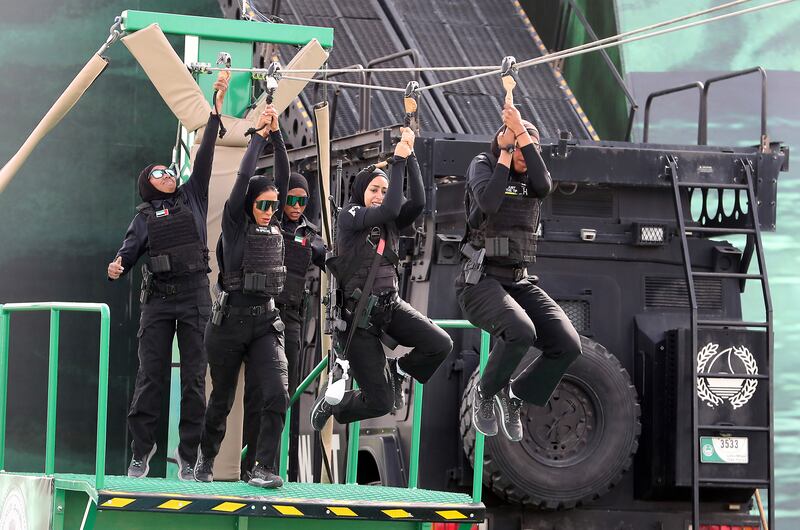The Abu Dhabi Police women’s team take on an obstacle course. Pawan Singh/ The National