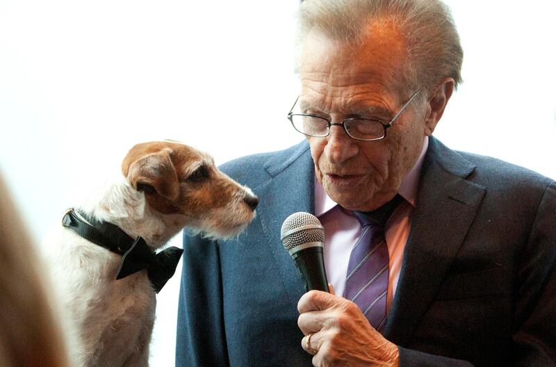Larry King interviews Uggie, the dog from the film The Artist, before the start of the Friars Club Roast of Betty White in New York on May 16, 2012. Reuters