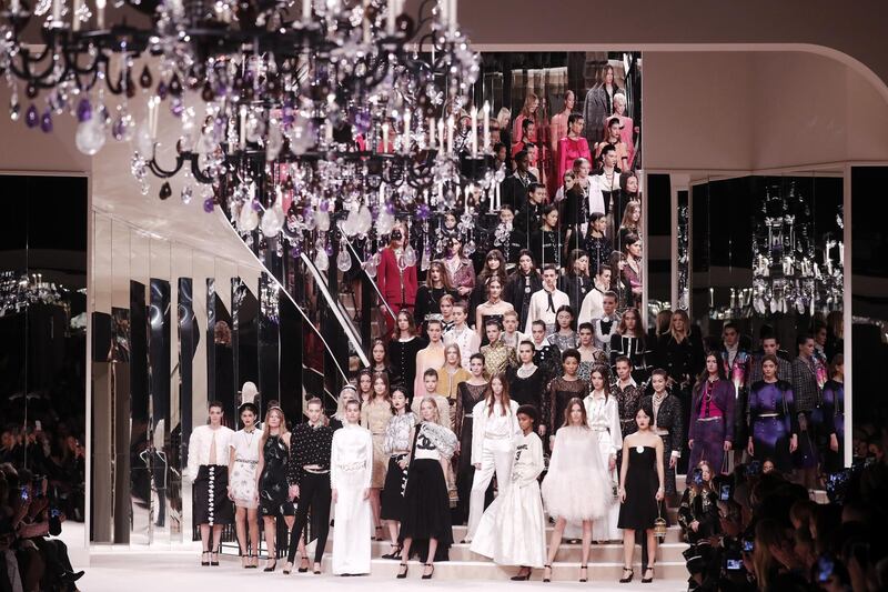 epa08044617 Models present creations during the Chanel Metiers d'Art 2019/2020 show held at the Grand Palais, in Paris, France, 04 December 2019. Chanel recreated the iconic curved mirrored staircase that leads to Coco Chanel's private apartment on Rue Cambon beneath the nave of the Grand Palais.  EPA-EFE/CHRISTOPHE PETIT TESSON