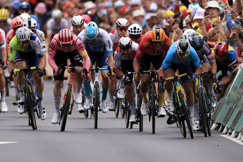 Danish rider Mads Pedersen of Lidl-Trek crashes as British rider Mark Cavendish, front right, fights to cross the finish line and win Stage 5. EPA