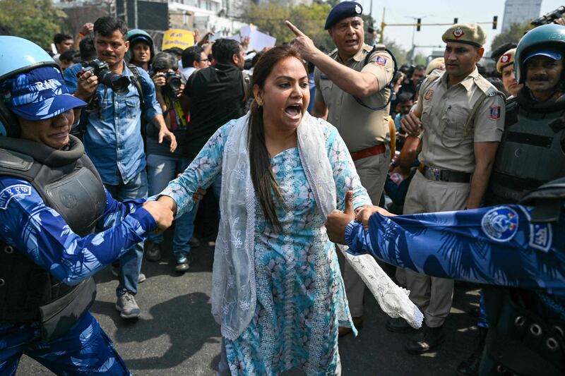 Police detain supporters of the Aam Aadmi Party, as they protest against the arrest of their leader Mr Kejriwal.  AFP