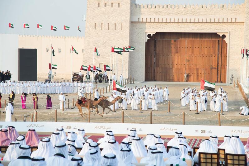 AL WATHBA, ABU DHABI, UNITED ARAB EMIRATES - December 03, 2017: Audience members watch the Union March, during the Sheikh Zayed Heritage Festival. 

( Mohamed Al Suwaidi for the Crown Prince Court - Abu Dhabi )
---
---