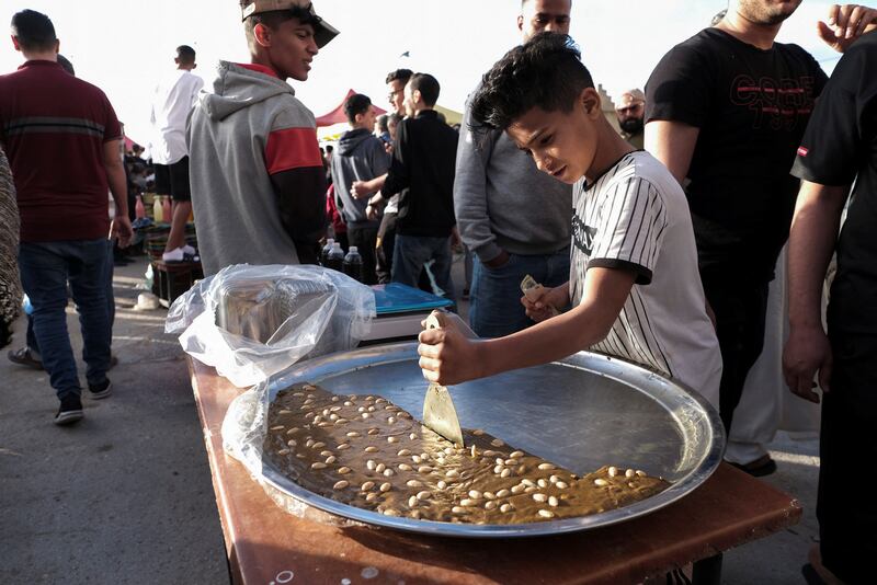 A boy cuts into a desert in Benghazi. Reuters