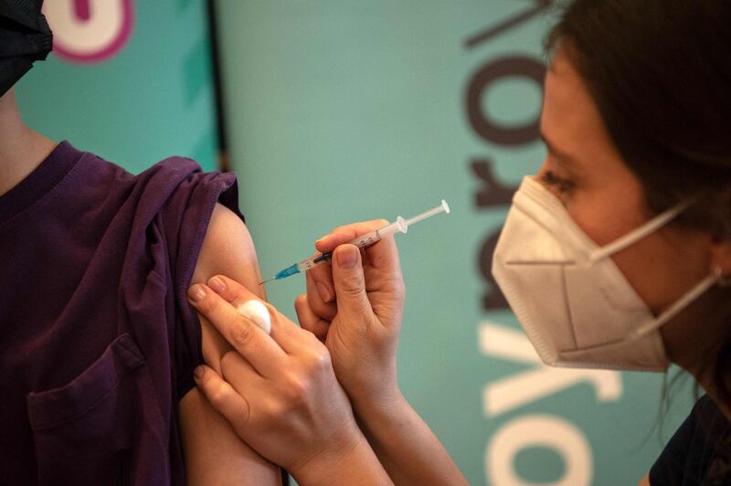 A health worker prepares a dose of the Pfizer-BioNTech Covid-19 vaccine at a vaccination centre in Santiago, Chile. AFP