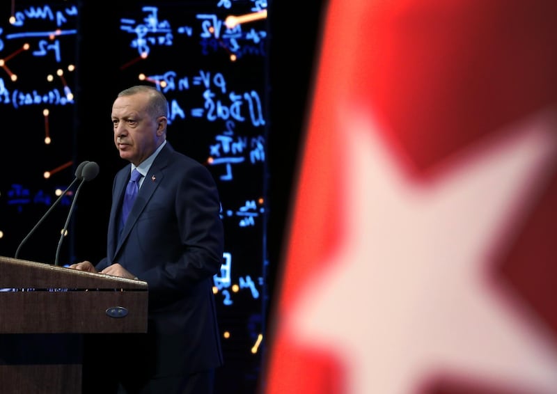 Turkey's President Recep Tayyip Erdogan delivers a speech at an event in Ankara, Turkey, Monday, Dec. 30, 2019. Turkey's government on Monday submitted a motion to parliament seeking approval to deploy troops to Libya, to help authorities in Tripoli defend the city from an offensive by rival forces, arguing that the conflict in the North African country could escalate into a civil war and threaten Turkey's interests.(Presidential Press Service via AP, Pool)