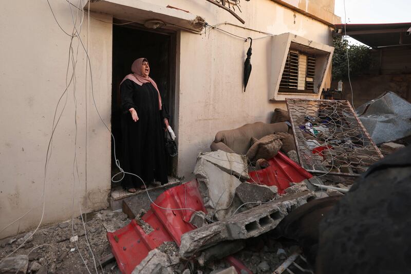 A neighbour said when they returned the home had been destroyed by the Israelis. AFP