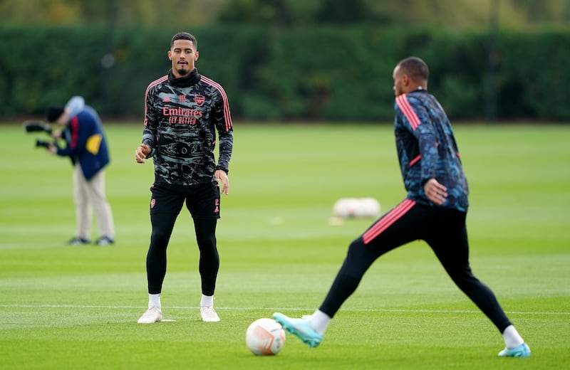 Arsenal's William Saliba, left, and Gabriel during training. PA