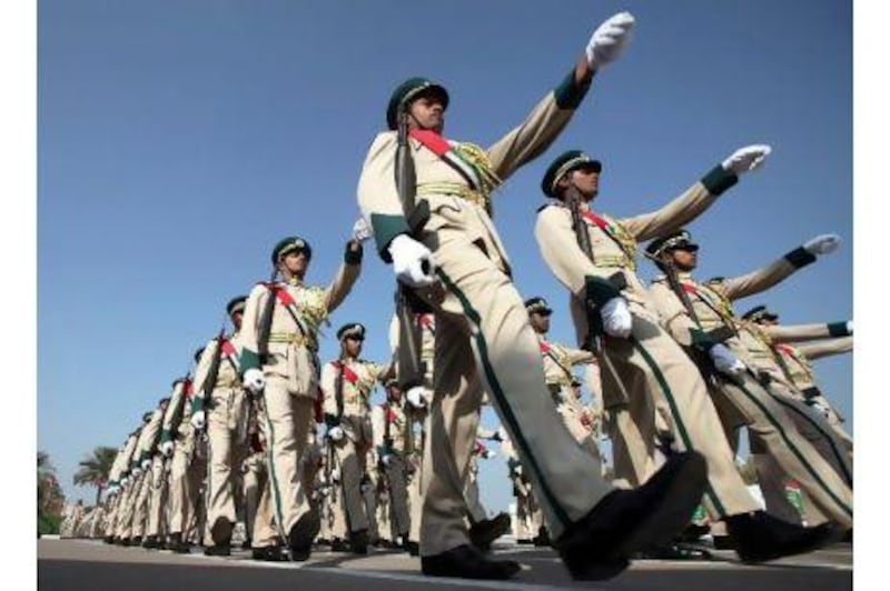 Newly graduated police officers take part in a parade at the Dubai Police Academy yesterday.