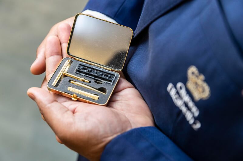 A gold razor is part of the ship's collection of memorabilia 