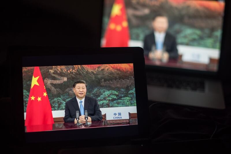 Xi Jinping, China's president, speaks during the United Nations General Assembly seen on a laptop computer. Bloomberg