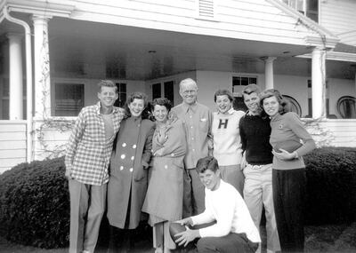 In this circa 1948 photo provided by the Kennedy Family Collection, courtesy of the John F. Kennedy Library Foundation, members of the Kennedy family pose for a photo in Hyannis Port, Mass. They are from left, John F. Kennedy, Jean Kennedy, Rose Kennedy, Joseph P. Kennedy Sr., Patricia Kennedy, Robert F. Kennedy, Eunice Kennedy, and in foreground, Edward M. Kennedy. The Boston-based museum completed an 18-month project in 2018 to catalog and digitize more than 1,700 black-and-white Kennedy family snapshots that are viewable online, giving a nation still obsessed with "Camelot" a candid new glimpse into their everyday lives. (Kennedy Family Collection/John F. Kennedy Library Foundation via AP)