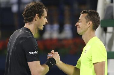 Andy Murray, left, Philipp Kohlschreiber greet each other at the net after the 2017 Dubai Tennis Championships quarter-finals. AP Photo