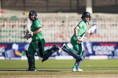 Ireland's bastmen William Porterfield (R) Paul Stirling run between the wickets during 2nd one day international (ODI) cricket match between Afghanistan and Ireland at Sharjah Cricket Association Stadium in Sharjah on December 7, 2017. / AFP PHOTO / NEZAR BALOUT