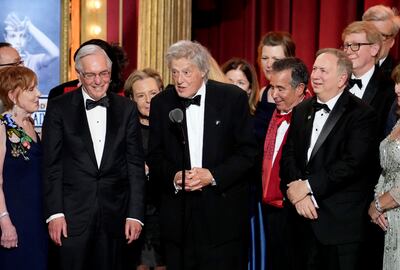 Playwright Tom Stoppard, centre, and members of the company of Leopoldstadt accept the award for best play at the 76th annual Tony Awards. AP