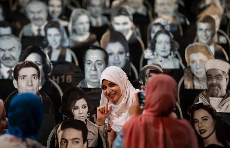 A woman poses for a photo at a concert in the Puppet Theater at El-Sawy Culture Wheel, Cairo. EPA/Mohamed Hossam