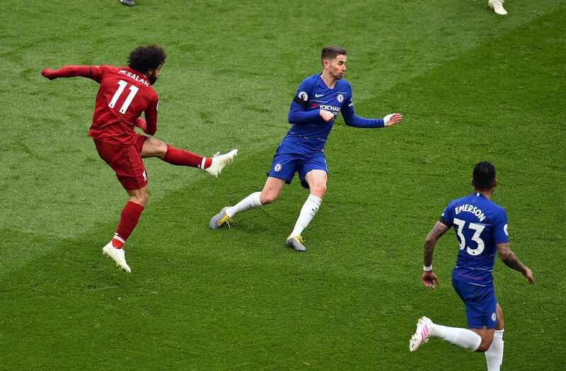 LIVERPOOL, ENGLAND - APRIL 14: (THE SUN OUT.THE SUNDAY SUN OUT) Mohamed Salah of Liverpool scores the first goal during the Premier League match between Liverpool FC and Chelsea FC at Anfield on April 14, 2019 in Liverpool, United Kingdom. (Photo by Andrew Powell/Liverpool FC via Getty Images)