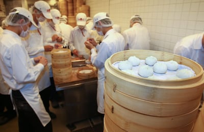 14 Aug 2012, Taipei, Taiwan --- (120814) -- TAIPEI, Aug. 14, 2012 (Xinhua) -- Working staff make steamed dumplings at Din Tai Fung Resaurant in Taipei, southeast China's Taiwan, July 23, 2012. Founded in 1972, Din Tai Fung has gradually earned its reputation worldwide. (Xinhua/Hou Dongtao) (mp) --- Image by © Hou Dongtao/Xinhua Press/Corbis