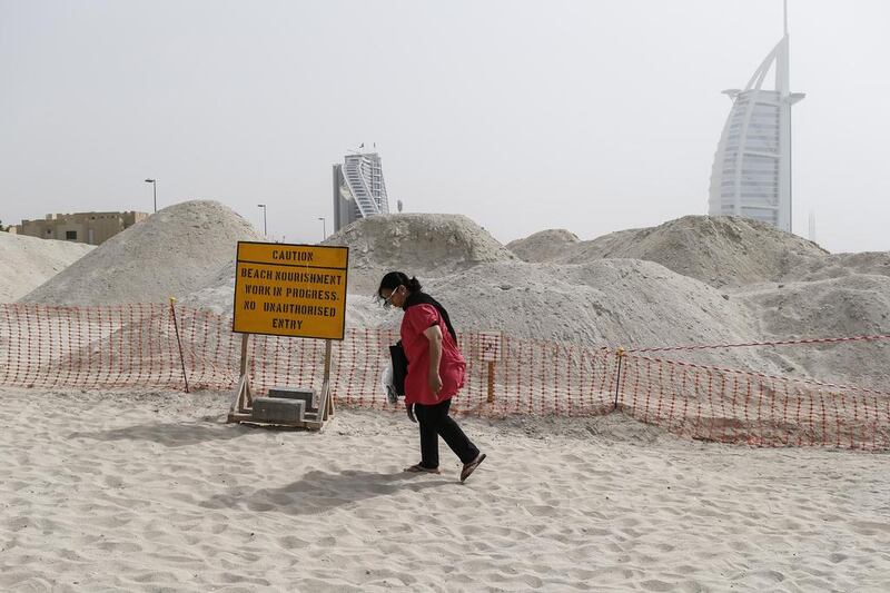 A sign warns beachgoers about construction work on a planned development along Jumeirah beach. Antonie Robertson/The National