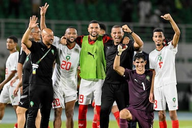 Morocco's players celebrate with Morocco's assistant coach Rachid Benmahmoud (3R) after their victory at the end of the Africa Cup of Nations (CAN) 2024 group F football match between Zambia and Morocco at the Stade Laurent Pokou in San Pedro on January 24, 2024.  (Photo by SIA KAMBOU  /  AFP)