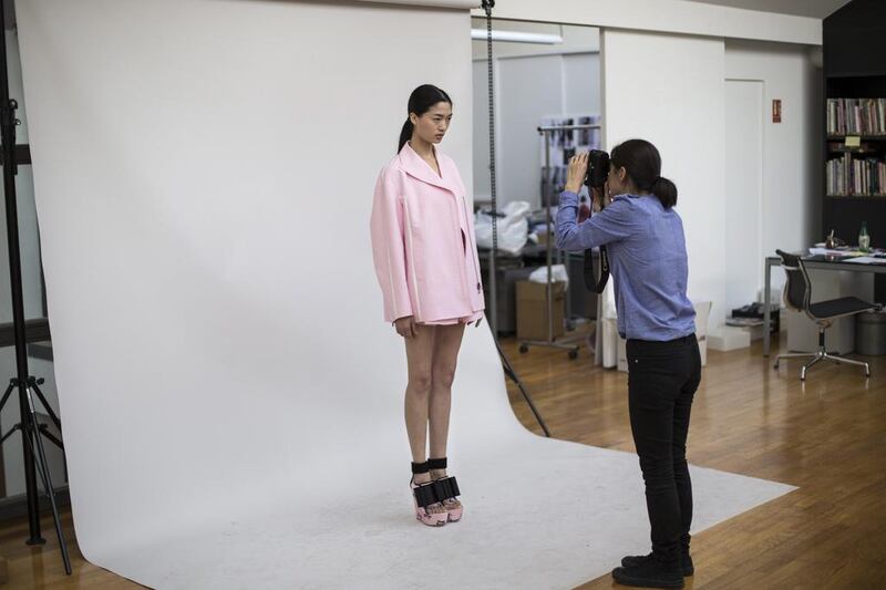 Qiwen Feng attends a fitting for the Spring/Summer 2014 Ready to Wear collection for John Galliano fashion house during Paris Fashion Week. Yoan Valat / EPA