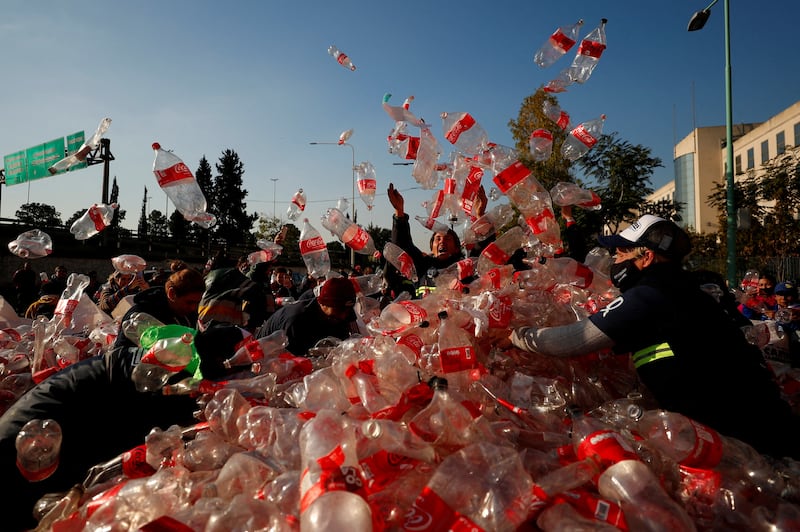 Rubbish recyclers protest outside Coca-Cola's offices in Buenos Aires, Argentina to demand that a recycling law includes them and against funding for private recycling systems. Reuters