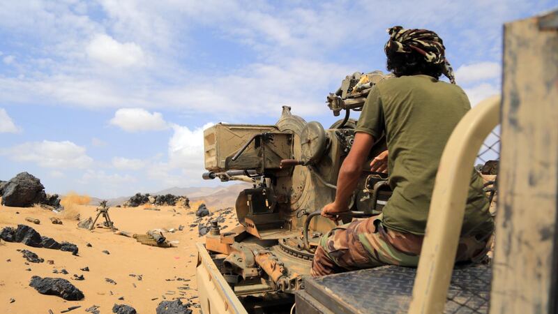 A fighter loyal to Yemen's Saudi-backed government takes position during the fight against Houthi militiamen in the northeastern province of Marib. EPA