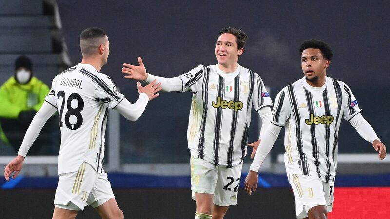 Juventus forward Federico Chiesa, centre, celebrates after opening the scoring. AFP