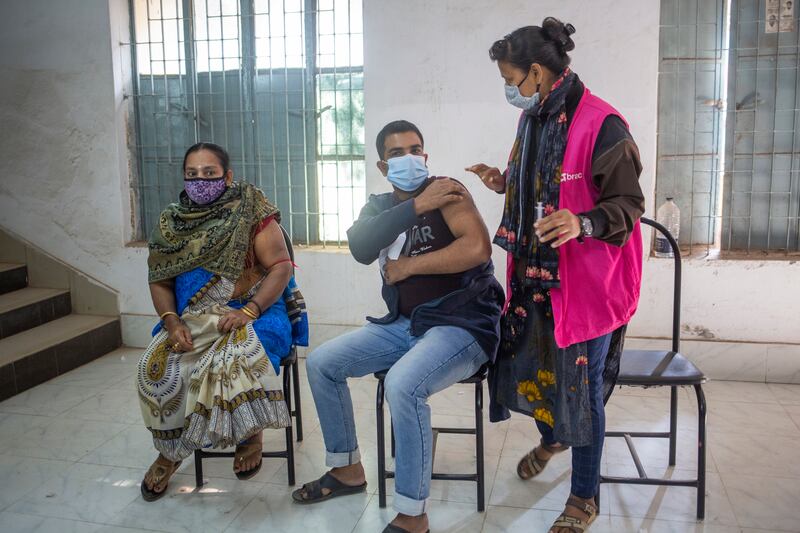 A man is vaccinated in Dhaka, Bangladesh, where there are fears the Omicron variant may cause a major rise in Covid-19 cases. EPA