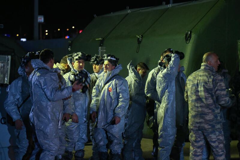 Chemical, Biological, Radiological and Nuclear (CBRN) unit soldiers prepare for the arrival of forty-two evacuees from Turkey, Azerbaijan, Georgia and Albania arriving by plane from coronavirus hit Wuhan, China, at the airport in Ankara, Turkey.  EPA