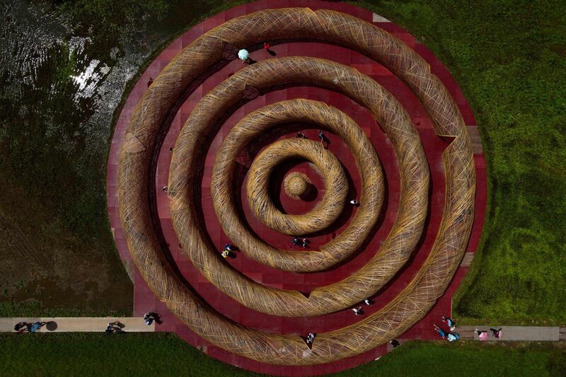 An aerial view shows tourists visiting the bamboo-made art installation 'The ripple maze at Gaoshuang' by Taiwanese artist Lee Kuei-Chih during the Art Land Festivals in Taoyuan. AFP