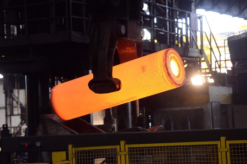 (FILES) In this file photo taken on April 15, 2013 a steel tube is being produced at a steel tubes factory in Duesseldorf, western Germany.  Imposed stiff tariffs by the United States on European, Mexican and Canadian steel and aluminium, that have come into effect on June 1, 2018, have sparked immediate countermeasures by Mexico and Canada, while the European Union threatened a similar response, throwing up the prospect of a painful conflict between some of the world's biggest economies. / AFP / Patrik STOLLARZ
