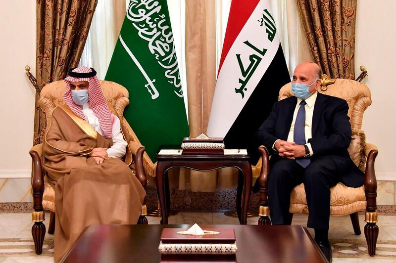 Iraqi Foreign Minister Fuad Hussein receiving his Saudi counterpart Prince Faisal bin Farhan al-Saud in Baghdad. AFP