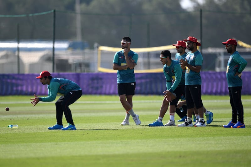 Afghanistan players attend a practice session at Zayed Cricket Stadium in Abu Dhabi on October 17, 2021. AFP