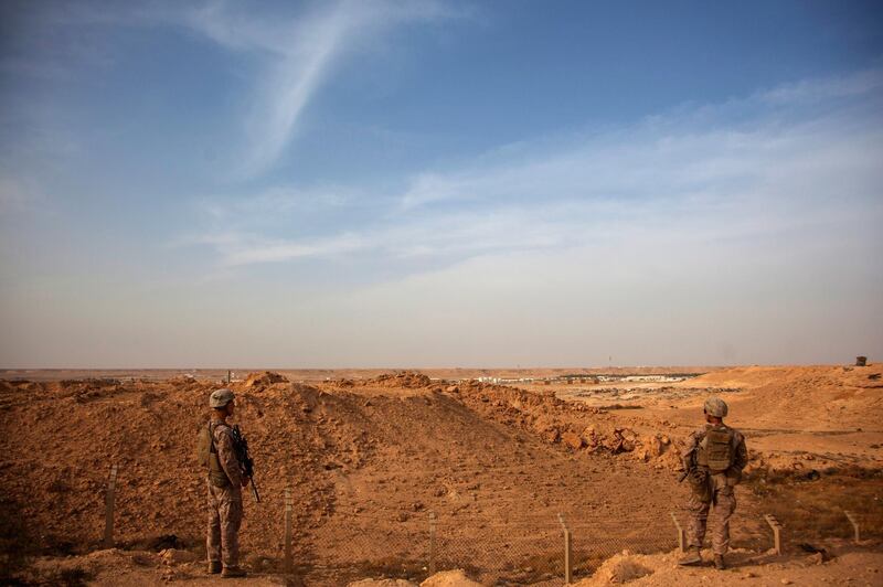 epa08112487 (FILE) - A handout photo made available by the US Marine Corps shows US Marines with Combined Anti-Armor Team, Weapons Company, 1st Battalion, 7th Marine Regiment, patroling inside the perimeter of Al Asad Air Base, Iraq, 23 Oct 2015 (reissued 08 January 2020). According to Iranian state TV on 08 January 2020, Iran's Revolutionary Guard Crops (IRGC) launched a series of rockets targeting al Asad air base, one of the bases hosting US military troops in Iraq. The attack comes days after top Iranian General Qasem Soleimani, head of the IRGC's Quds force, was killed by a US drone strike in Baghdad.  EPA/Cpl. Akeel Austin HANDOUT  HANDOUT EDITORIAL USE ONLY/NO SALES