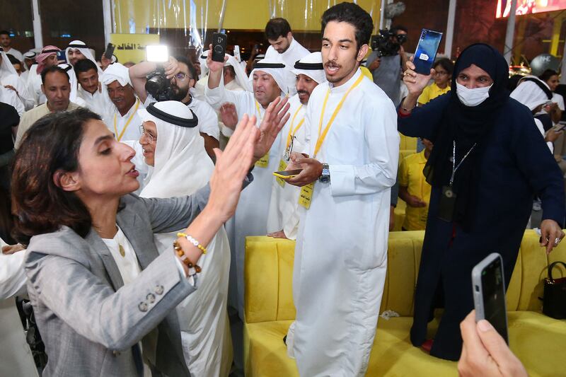 Alia Al Khaled, left, celebrates with her supporters after becoming one of two women elected to Kuwait's parliament in elections held on September 29. AFP