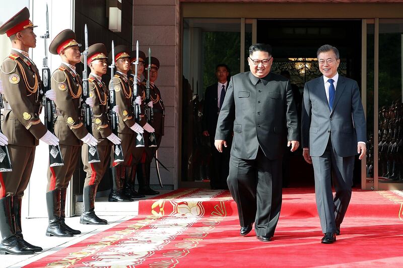 PANMUNJOM, NORTH KOREA - MAY 26: In this handout image provided by South Korean Presidential Blue House, South Korean President Moon Jae-in (R) walks with North Korean leader Kim Jong-un (L) during their meeting on May 26, 2018 in Panmunjom, North Korea. North and South Korean leaders held the surprise second summit after U.S. President Donald Trump cancelled the meeting with Kim Jong-un scheduled for June 12. Trump has since indicated that the meeting could take place a day after.  (Photo by South Korean Presidential Blue House via Getty Images) *** BESTPIX ***